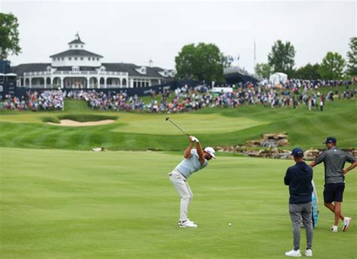 Can caddies remove ball from hole?