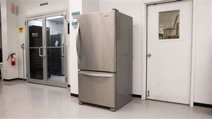 Can you transport a Whirlpool refrigerator laying down?