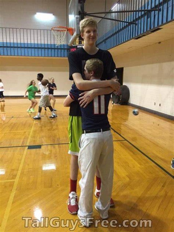 How do you hug a tall guy?