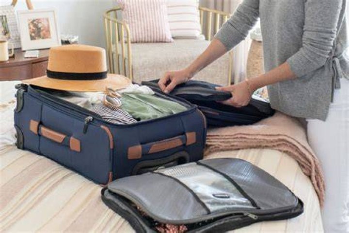 How do you pack clothes in a suitcase?