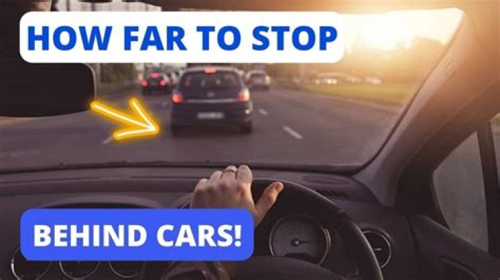 How far behind should you stop behind a car?