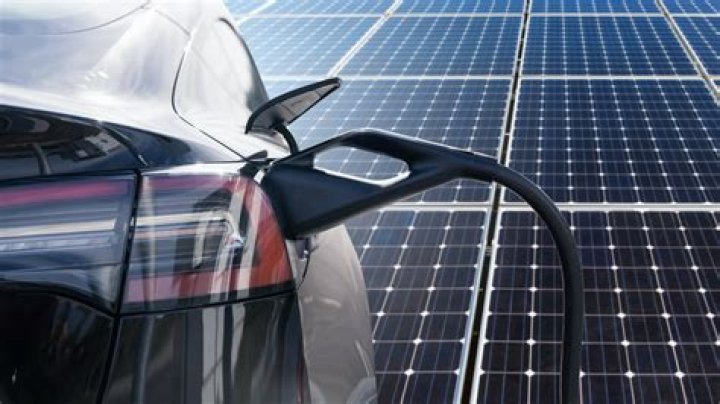 How many solar panels does it take to charge a Tesla?