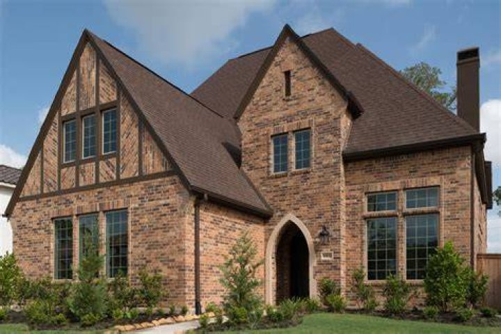 Is brick veneer more expensive than siding?