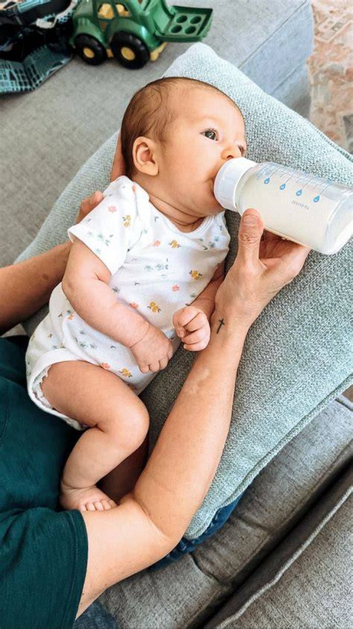 Is it safe to feed baby lying down?