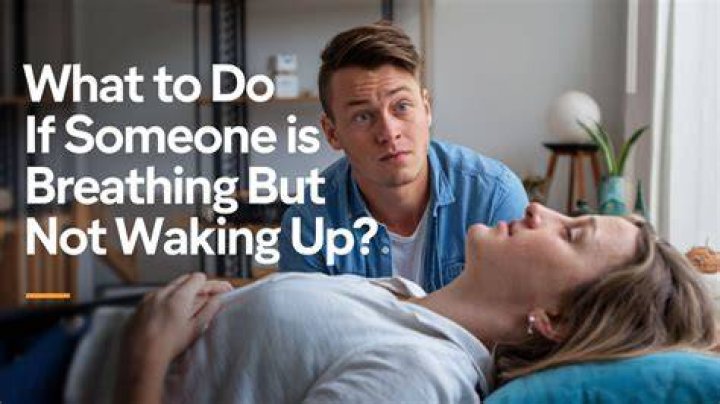 What to do if someone is breathing but not waking up?