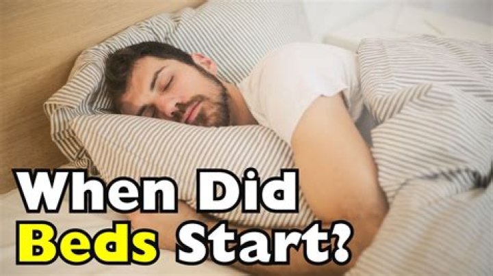 When did humans start sleeping in beds?