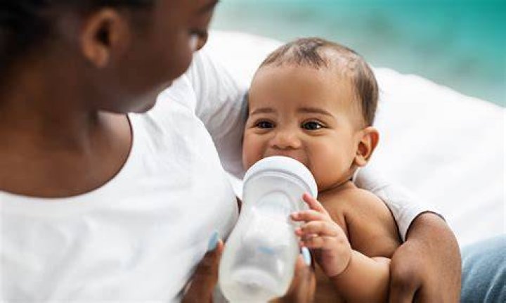 Why do babies hold your finger when feeding?